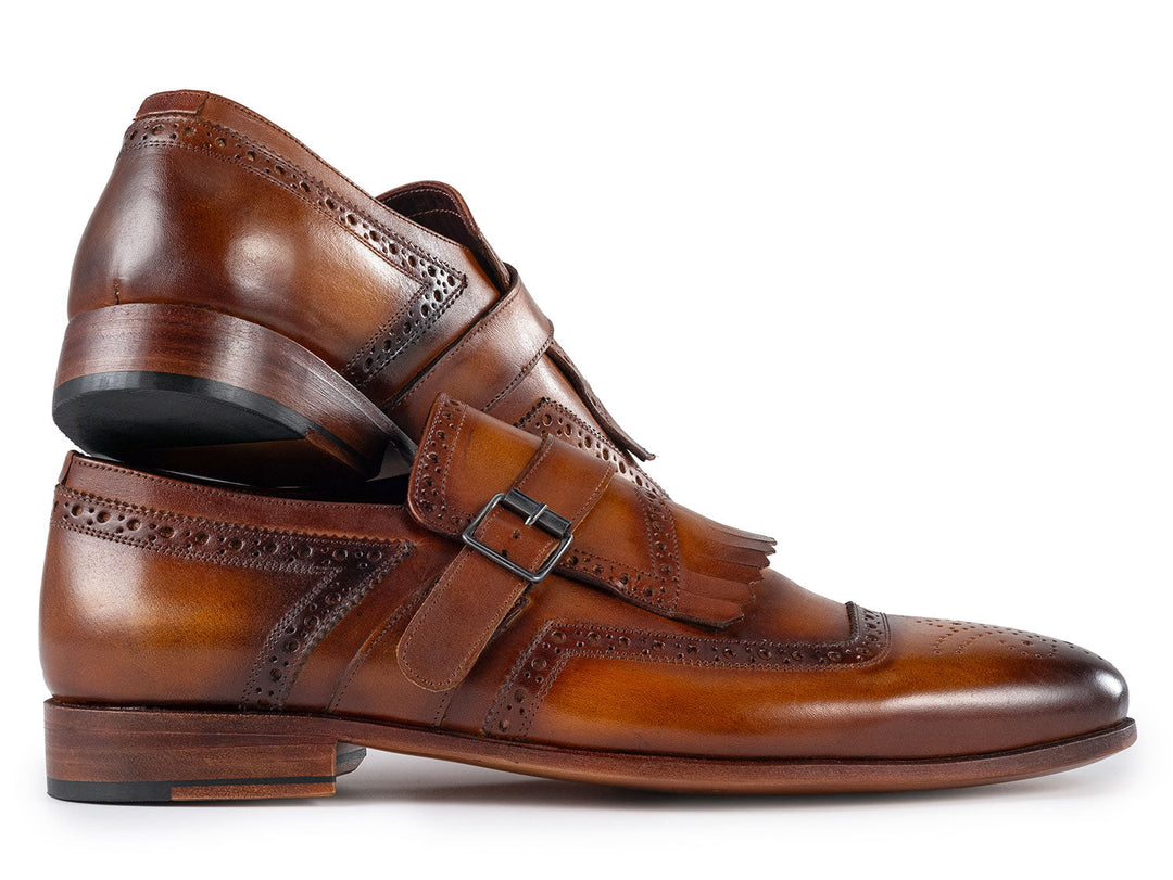 Handmade brown leather men's monkstrap shoes with kiltie and intricate stitching