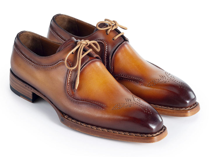 Hand-welted camel brown leather derby shoes with laces and stitching detail