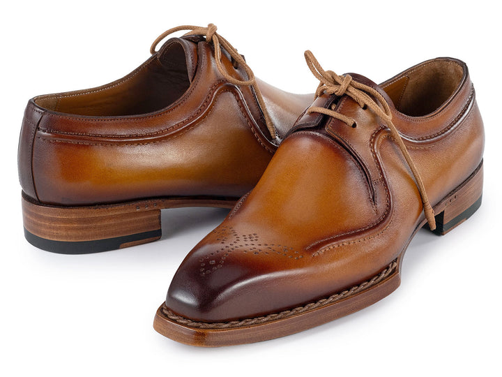 Luxurious men's footwear in rich camel brown leather with hand-welted construction