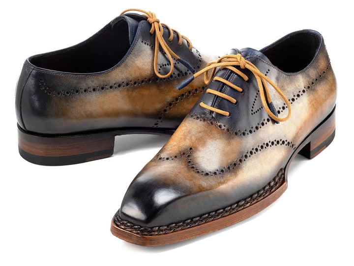 Handcrafted Paul Parkman Goodyear Welted Men's Wingtip Oxfords in camel and navy color combination, featuring exquisite craftsmanship and timeless style (ID#81CML62)