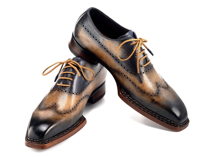 Handcrafted Paul Parkman Goodyear Welted Men's Wingtip Oxfords in Camel and Navy color combination, perfect for a stylish and sophisticated look