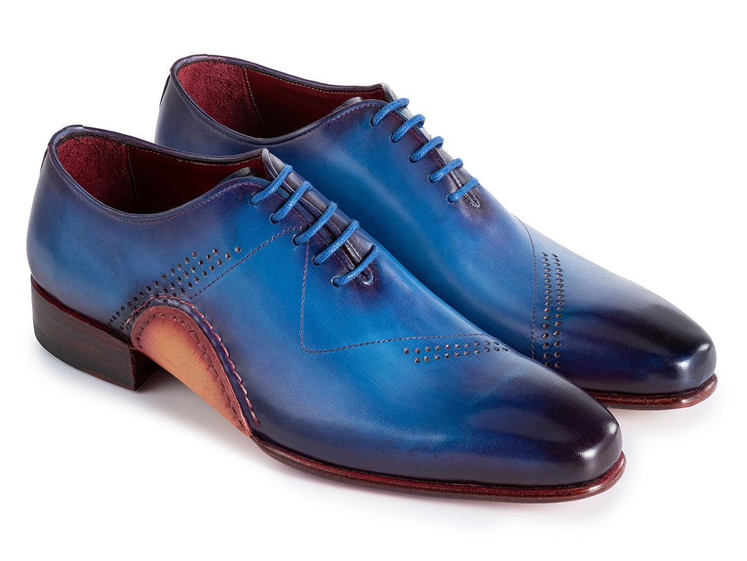 Handcrafted blue leather oxfords with hand-painted details and opanka construction