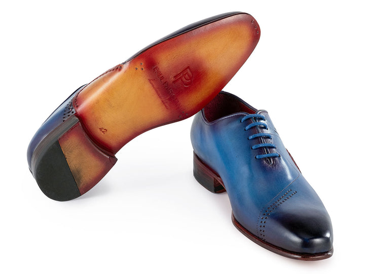 Elegant men's dress shoes in oxford style featuring hand-painted blue leather