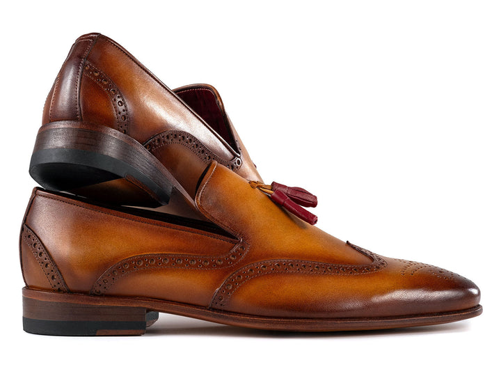 Elegant and sophisticated Paul Parkman Men's Wingtip Tassel Loafers in brown leather featuring intricate wingtip and tassel design